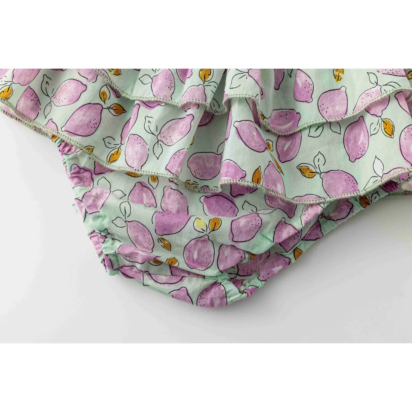 ruffle detail of purple lemon baby girl diaper cover