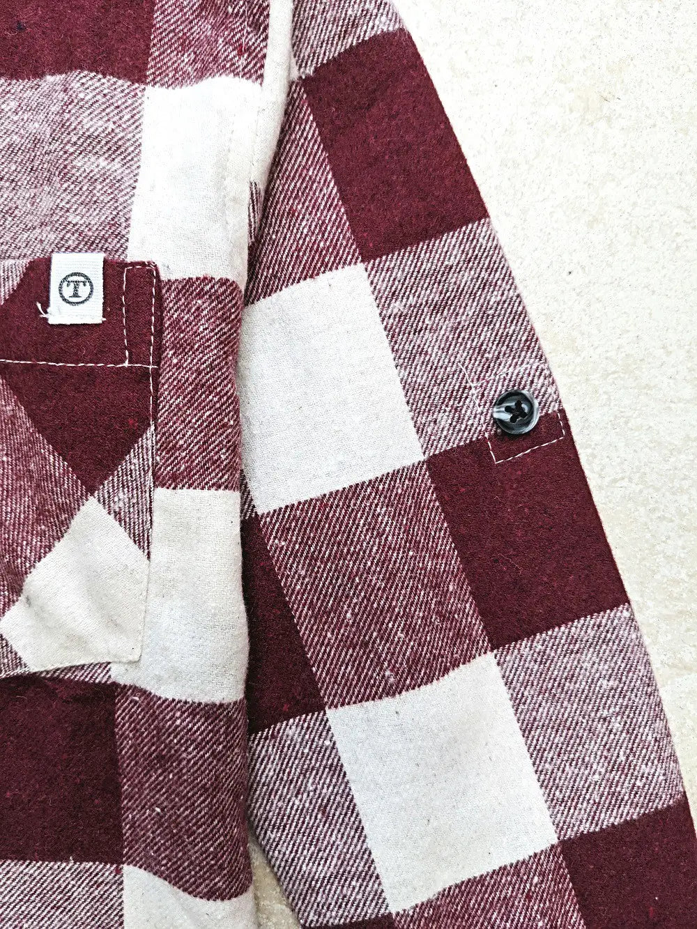 sleeve detail on boys flannel shirt with red and white checkers