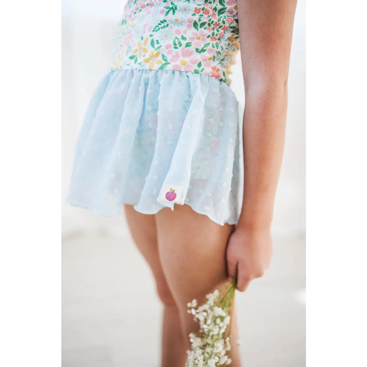 skirt detail on floral leotard