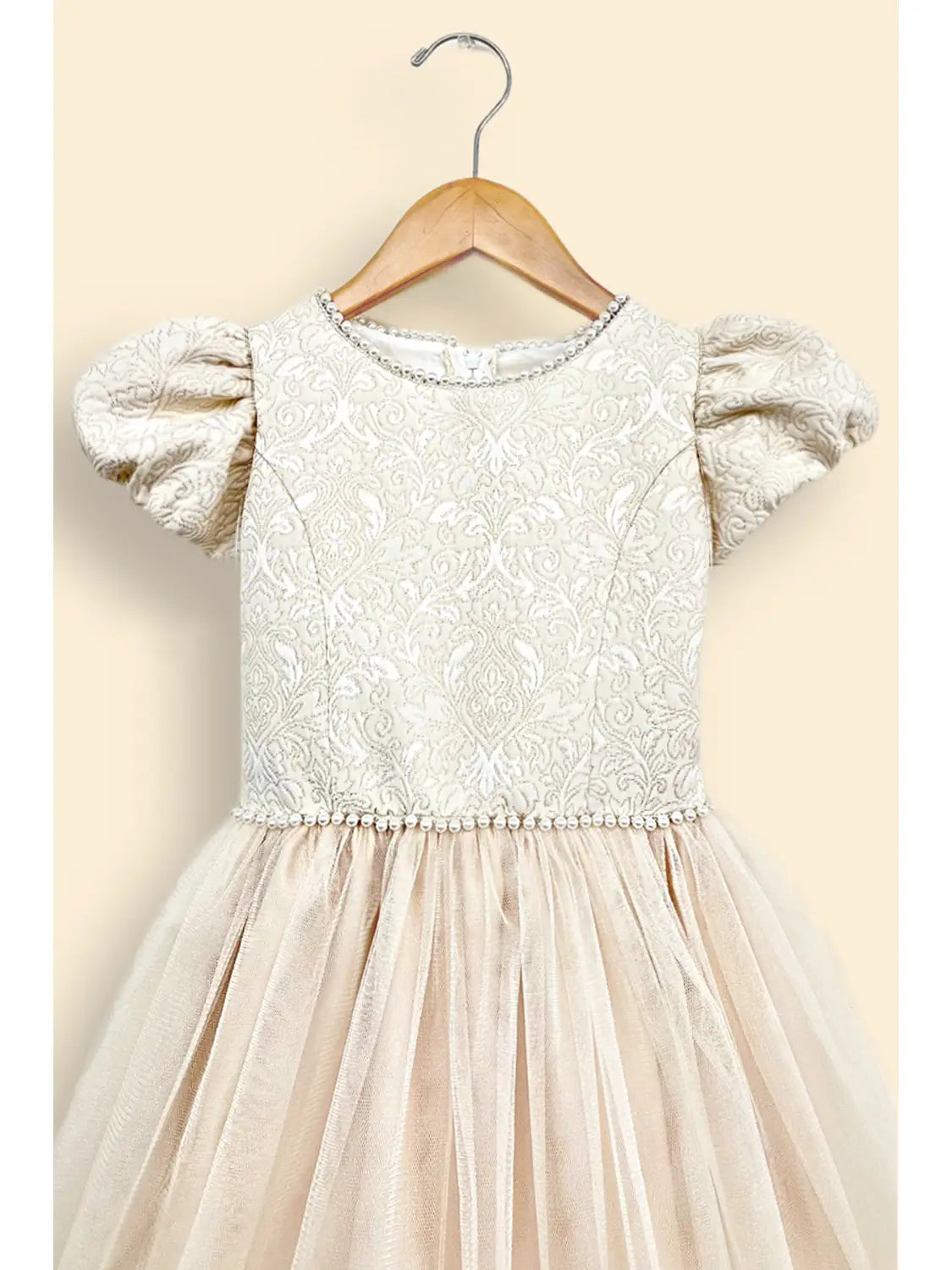 tween girls special occasion formal cream color dress with pearl beads at neck and waist, jacquard bodice with puff sleeves and a satin tulle skirt