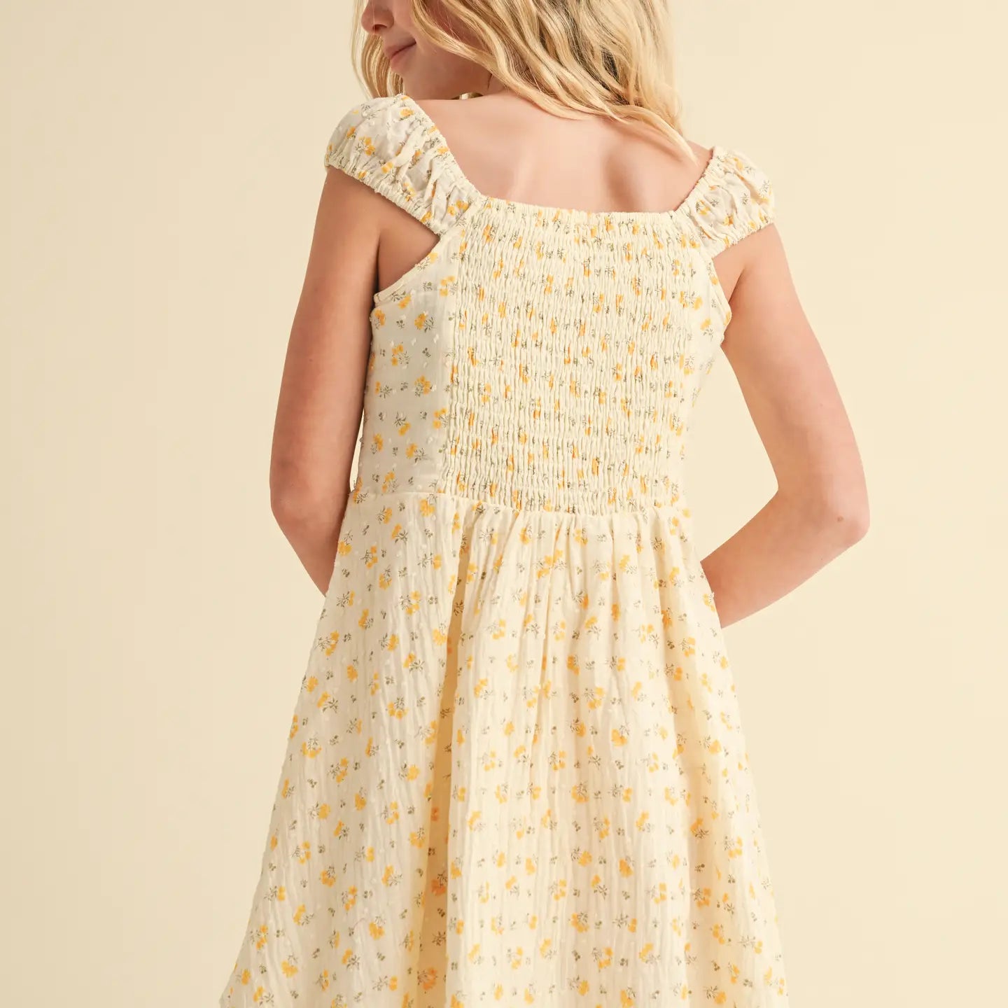 back details of yellow sundress on teenager