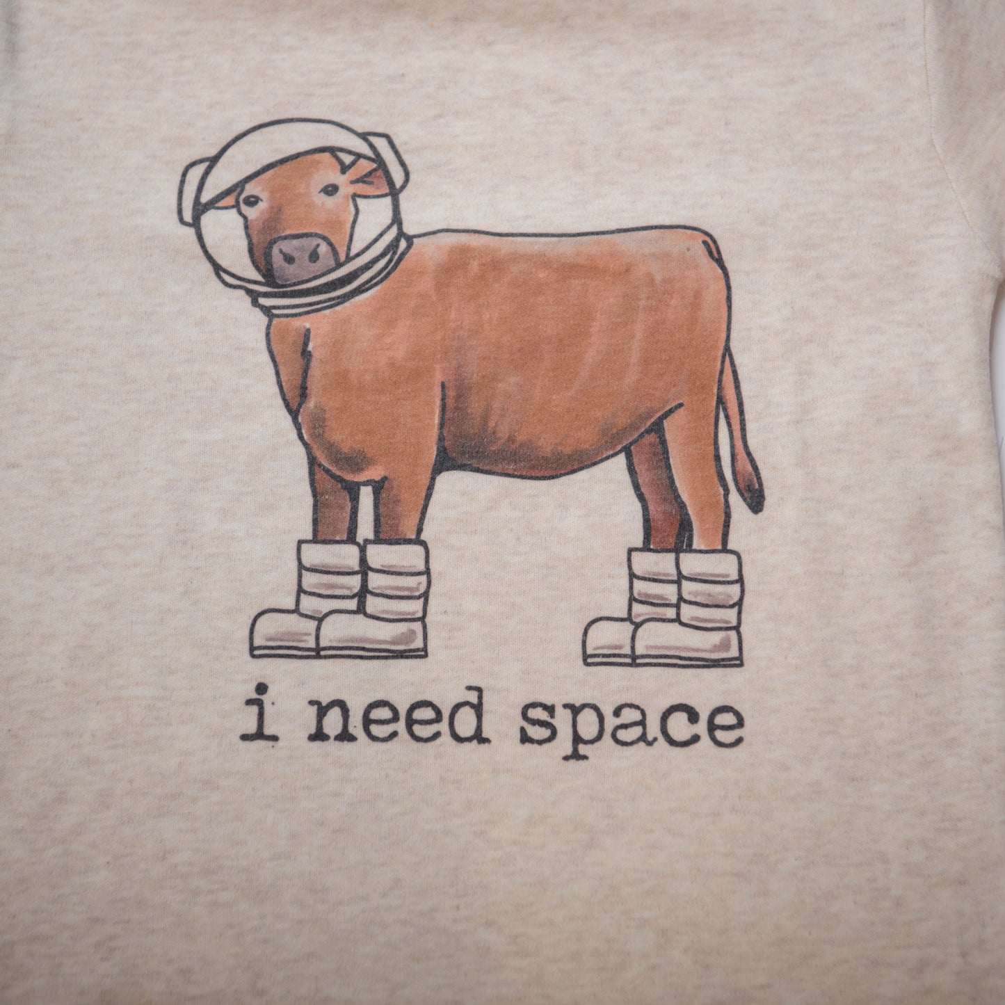 cow on t-shirt wears space boots and space helmet