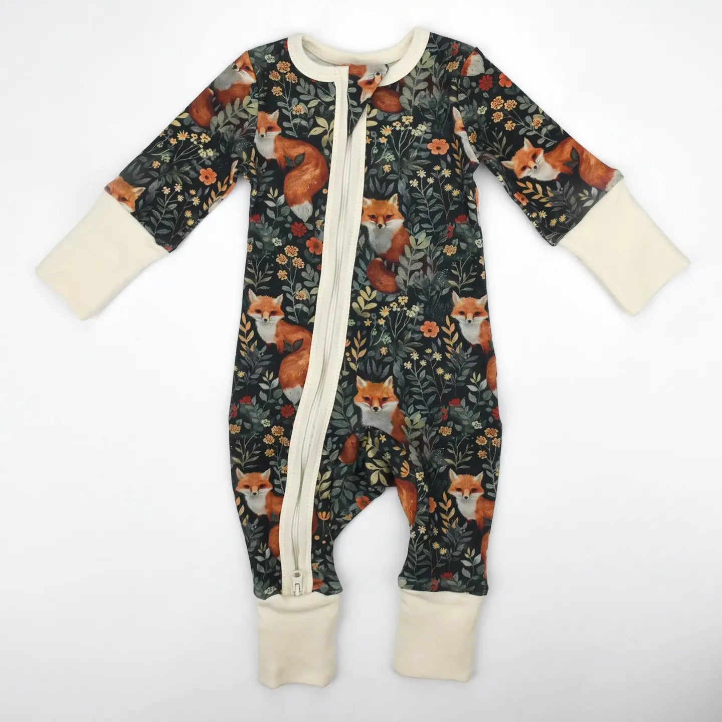 organic cotton baby pajamas with a dark green, white and orange theme