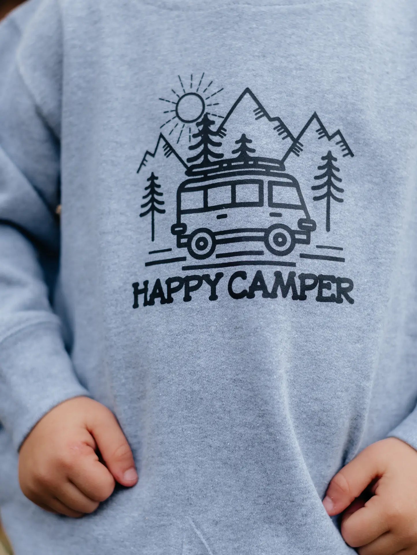 camping theme graphic on kids hoodie with camper trees and mountains