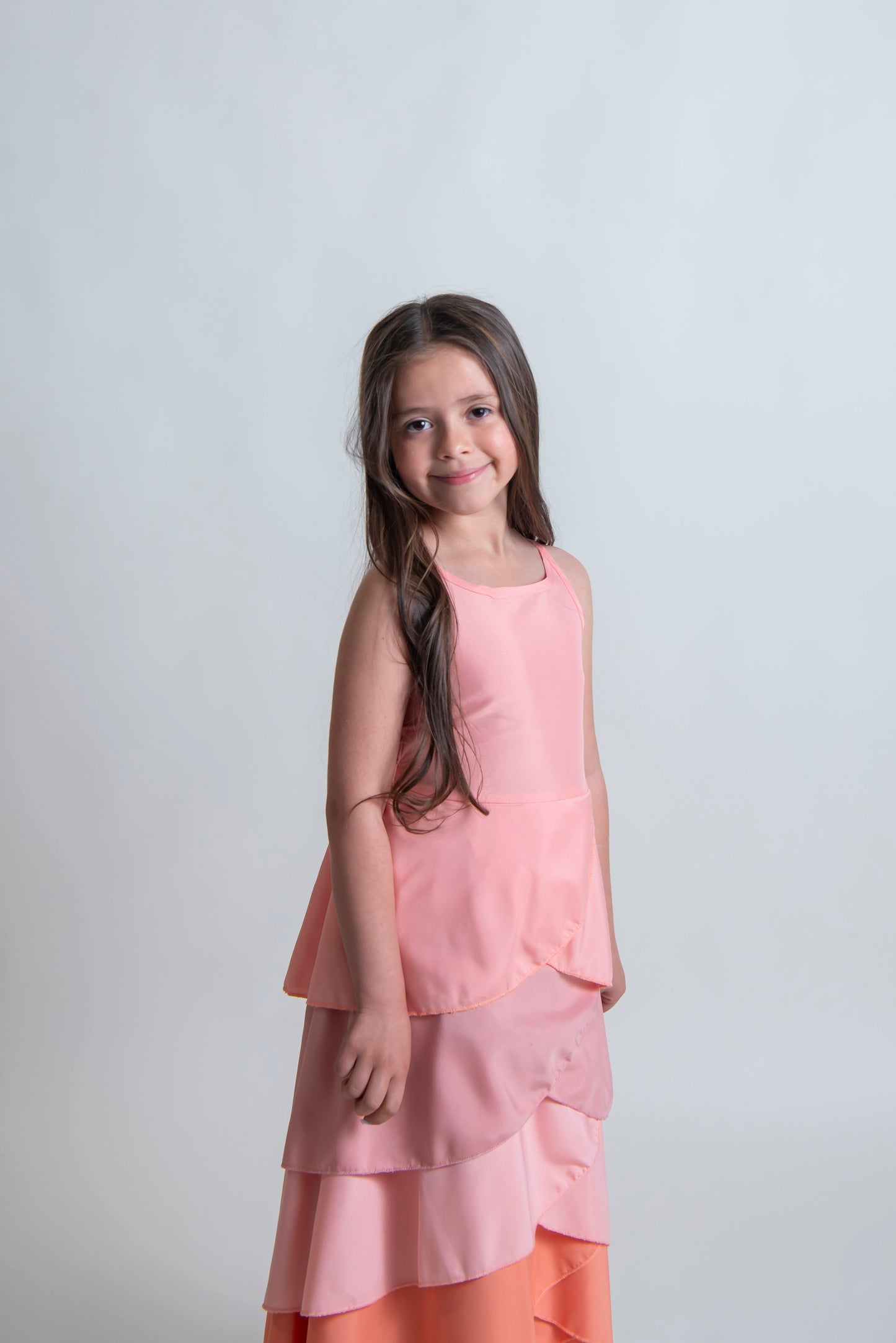 girls peach special occasion dress with high front and open back