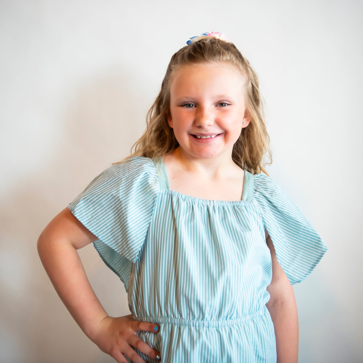 top of girls pantsuit with large loose sleeves and elastic waist