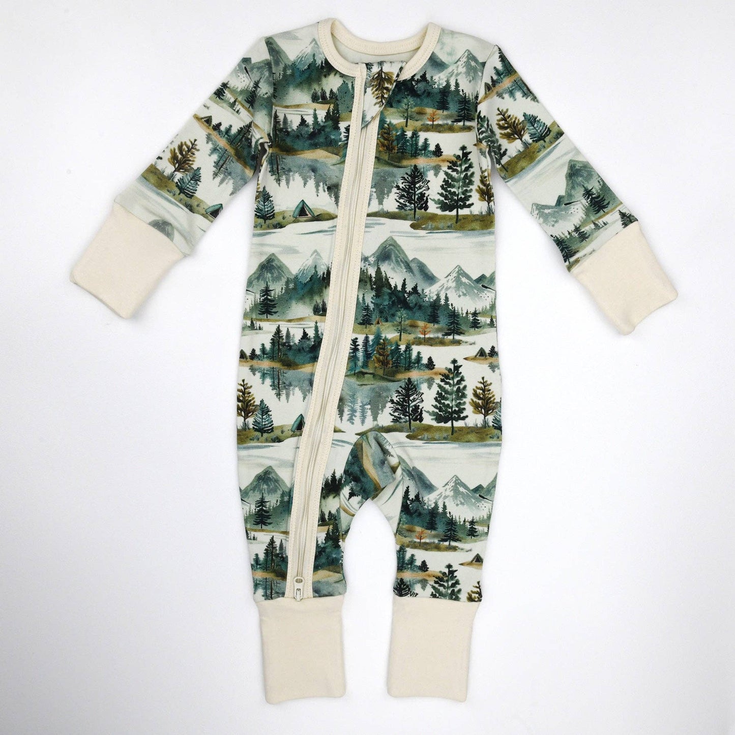 Baby onesie with nature-themed print on a white background