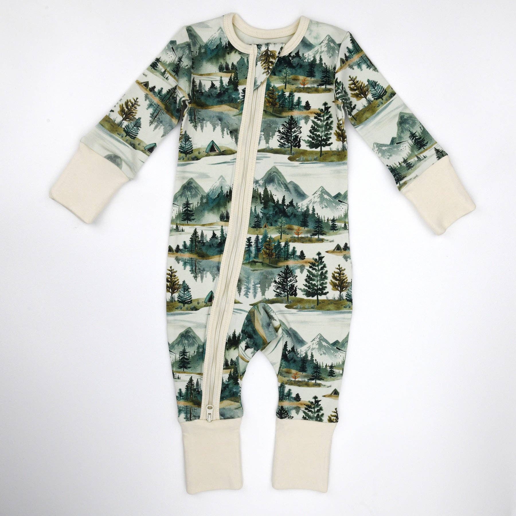 Baby onesie with nature-themed print on a white background