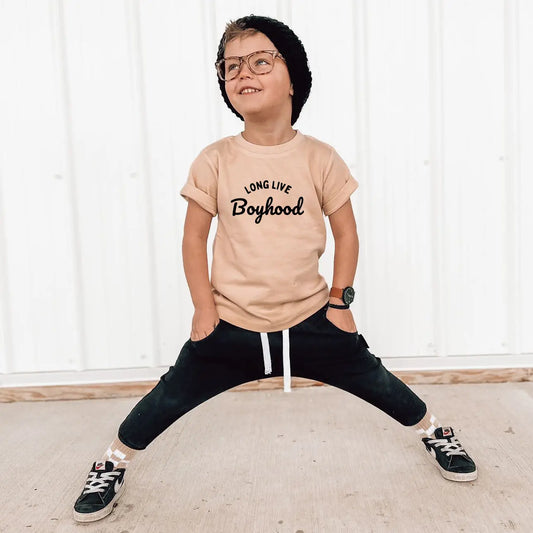 Beigh t-shirt that says "Long live boyhood" on it in black letters