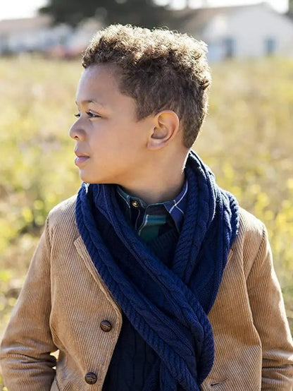 boy wearing knit scarf and brown corduroy jacket