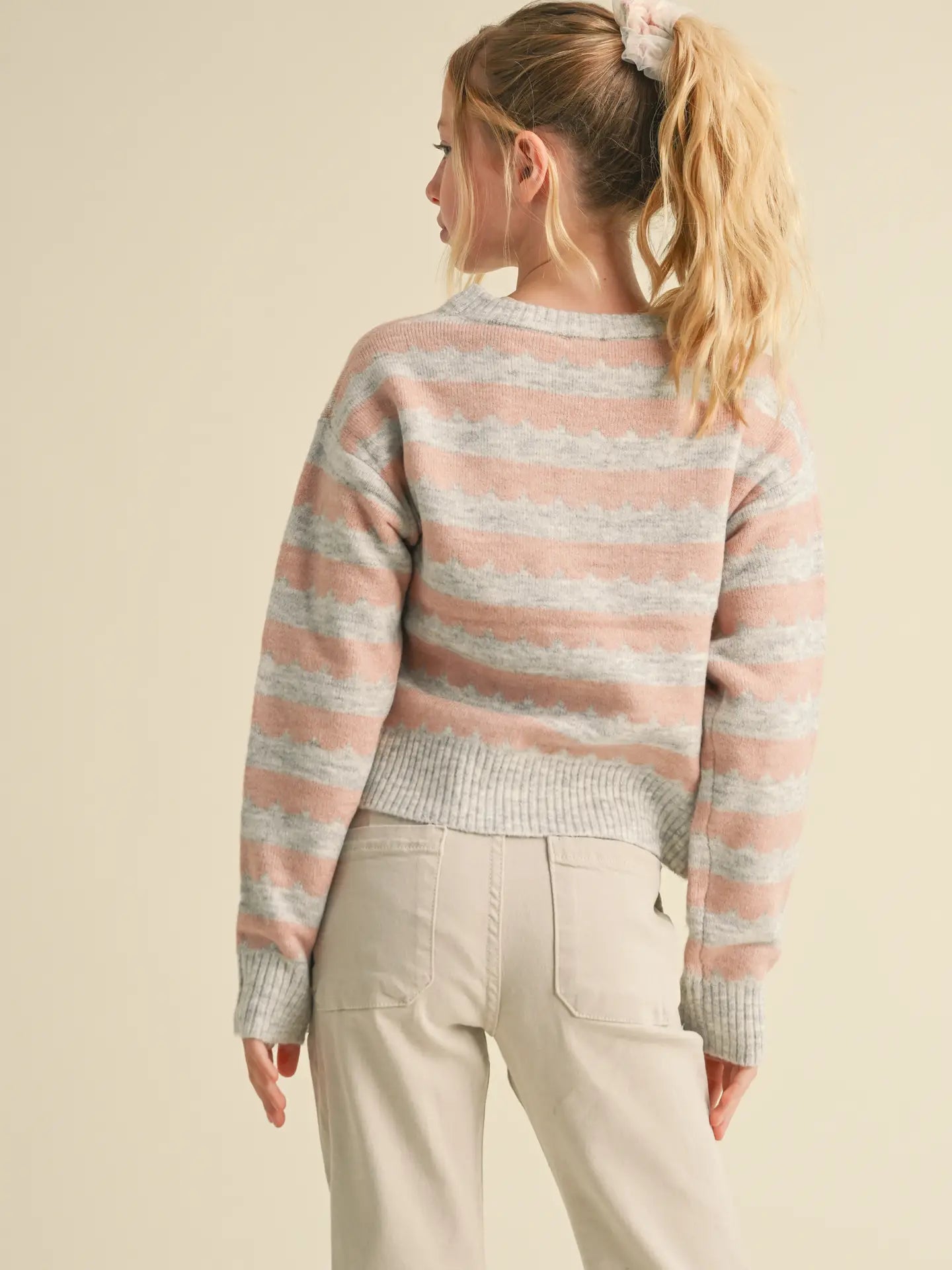 back of tween grey and pink stripe crew neck sweater made of soft knit cotton