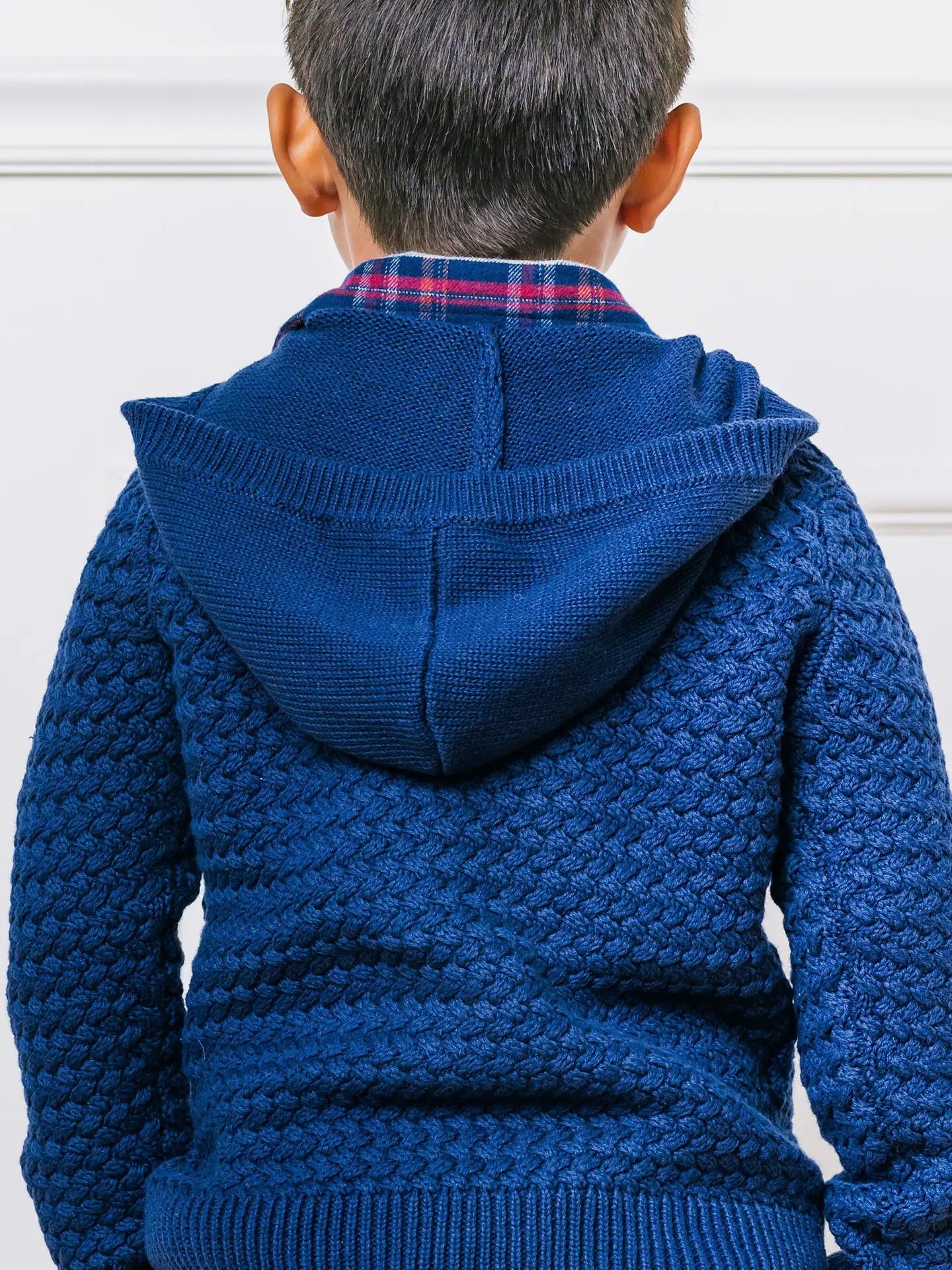 back of hooded boys navy blue sweater