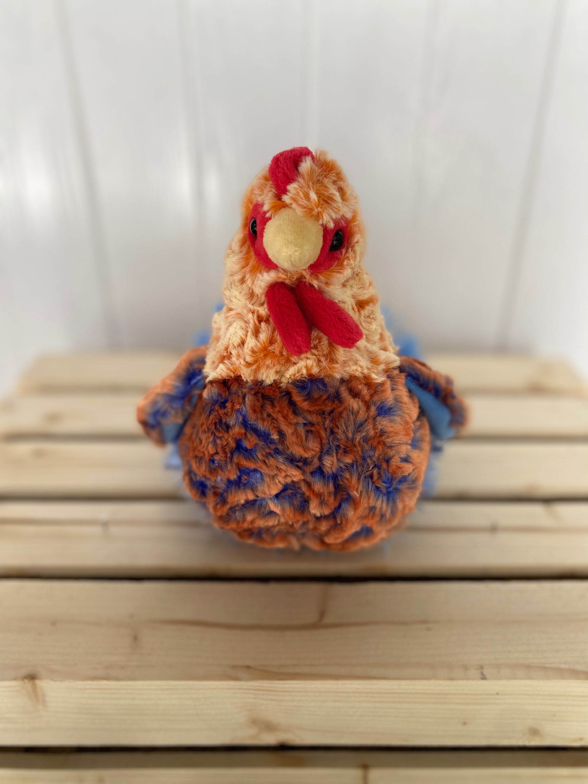 blue lace hen plush toy with orange and blue body 
