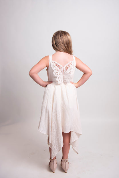 tween girl back of cream dress with butterfly lace detail