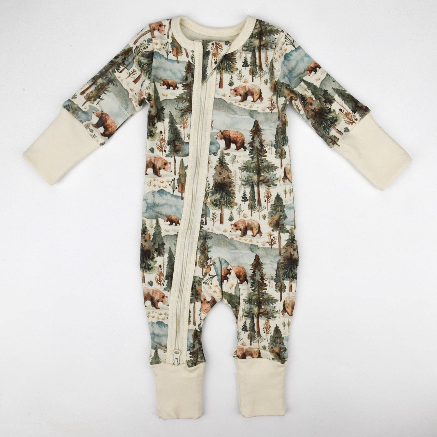 Baby onesie with forest and bear pattern on a white background