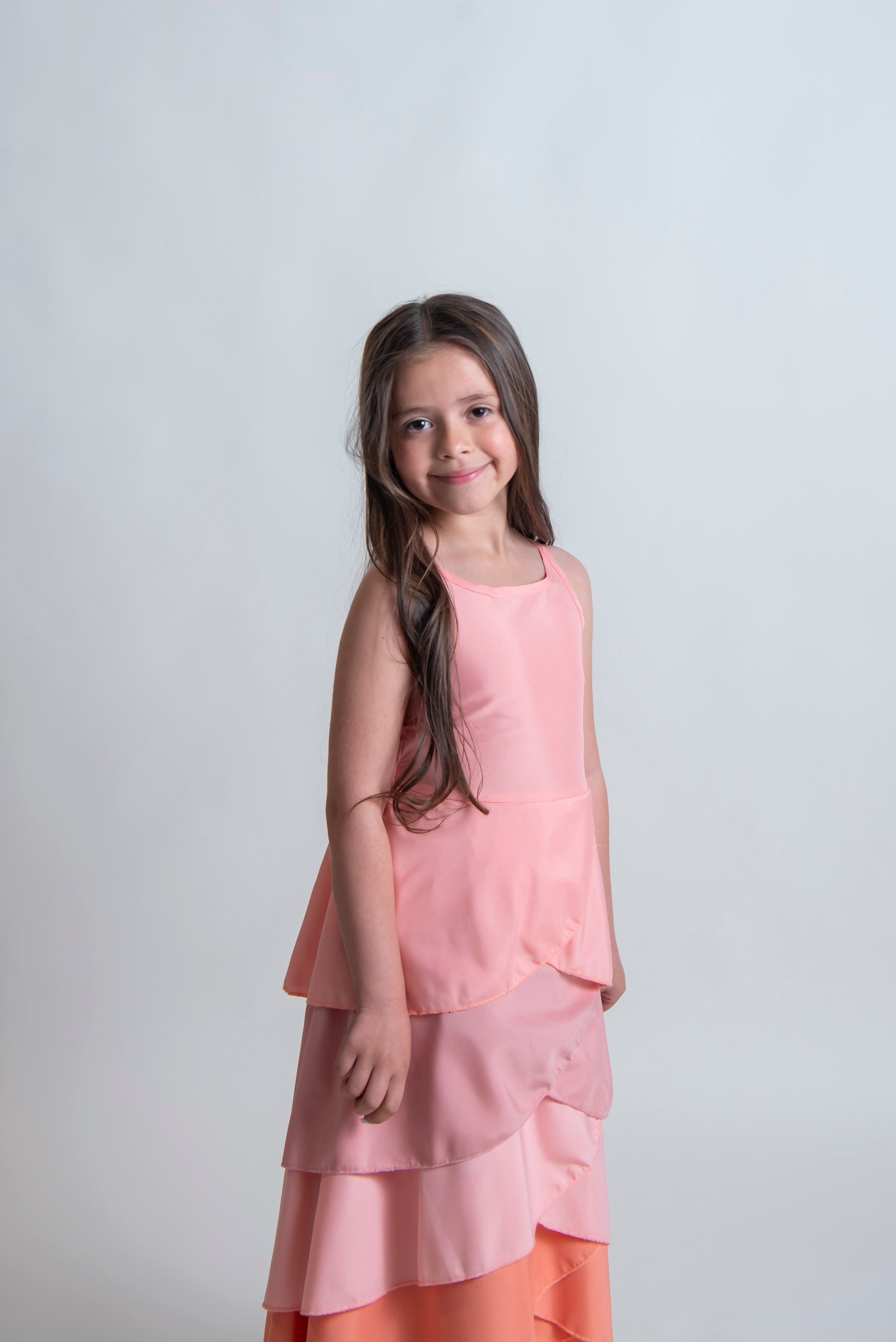 girls peach special occasion dress with high front and open back