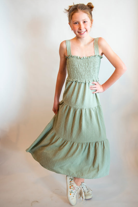 Tween wearing a midi green sundress