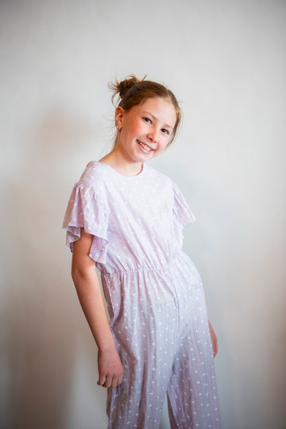 tween girl in purple outfit